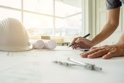 hands-engineer-working-blueprint-